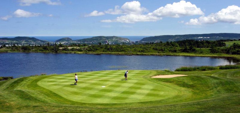 Putting on a golf green along the coast of Avalon Peninsula in Newfoundland. 