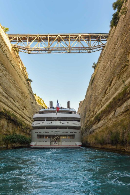 Ponant's Le Lyrial slices through the Corinth Canal in the Aegean Sea.