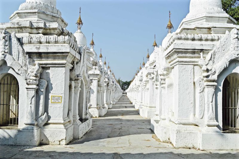 A stunning white temple with inscribed Sanskrit texts in Myanmar. 