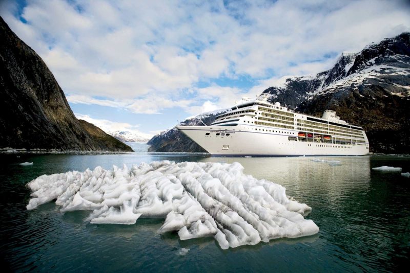 Seven Seas Mariner navigates through a channel carved by glaciers during a summer sailing to Alaska.