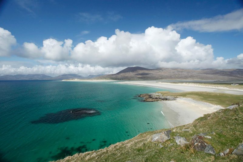 White sands and turquoise sea come together at Seilebost Beach on the Isle of Harris in the western islands of Scotland.