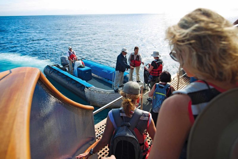 Boarding a Zodiac in the Galápagos during a Celebrity Cruises expedition.