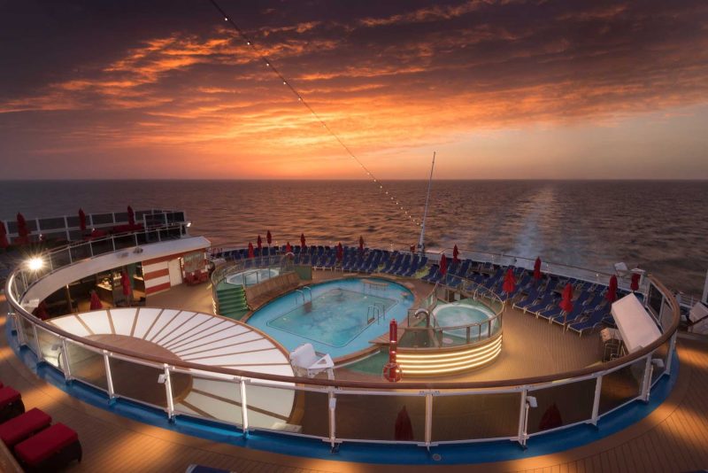 The aft deck of Carnival Horizon at dusk.