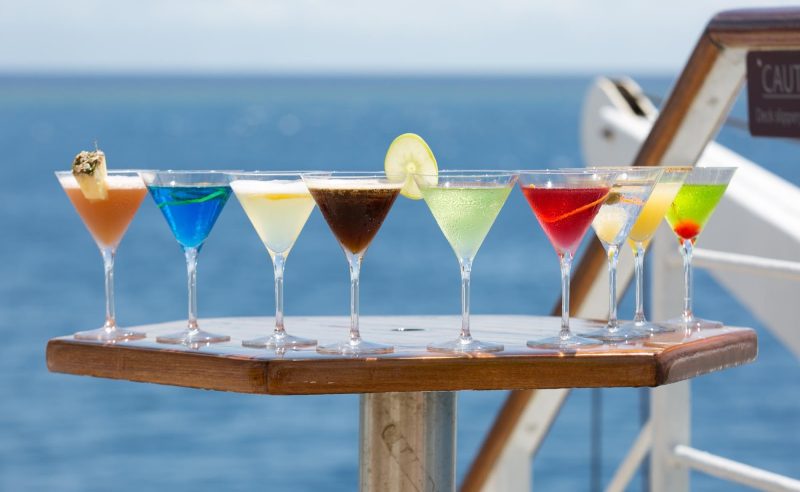 Enjoy a cocktail on deck on your next cruise.