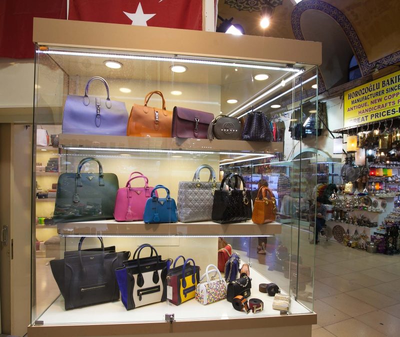 Fashionable Western-style handbags in a store's display case at the Grand Bazaar in Istanbul.
