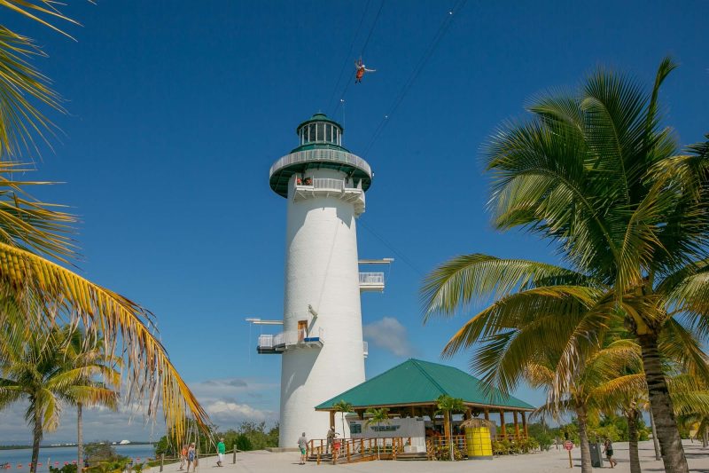 Go ziplining across the water from the Flighthouse at Harvest Caye in Belize.