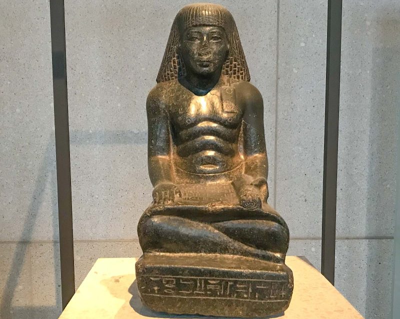 Egyptian scribe statue of Sobek-hotep, chief of the treasury, dated to 1397-1428 B.C. at the Neues Museum in Berlin. 