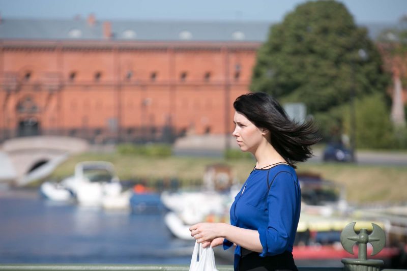 A local woman crosses the footbridge leading to Peter and Paul Fortress in St. Petersburg, Russia.