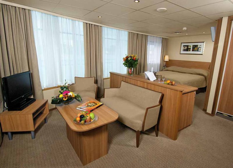 Relax after a busy day of sightseeing in Russia in your luxurious suite on Viking Truvor.