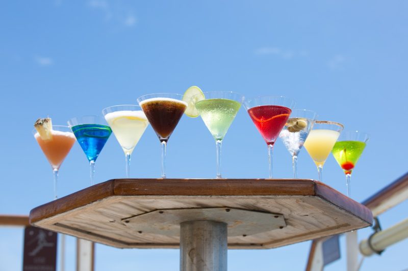 Enjoy a cocktail on deck on your next cruise.