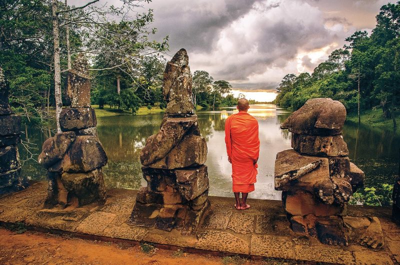 A monk looks out over the Mekong River at one of the stops on an AmaWaterways cruise.