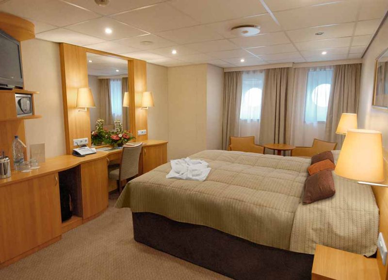 Relax after a busy day of sightseeing in Russia in your luxurious suite on Viking Truvor.