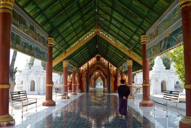 A beautiful covered walkway in a temple complex in Myanmar.