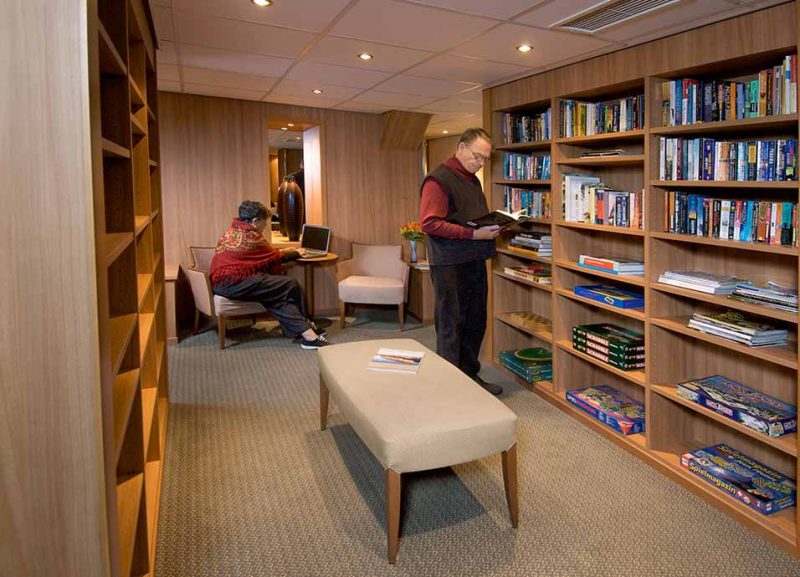 Read up your next destination or grab a board game in the library of Viking Truvor.