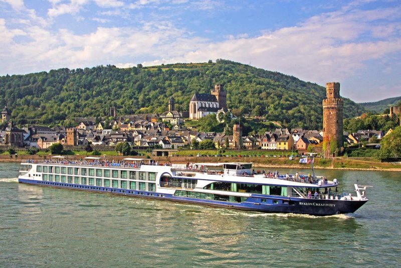 Avalon Creativity sails through a historic district in Germany on the Rhine River.