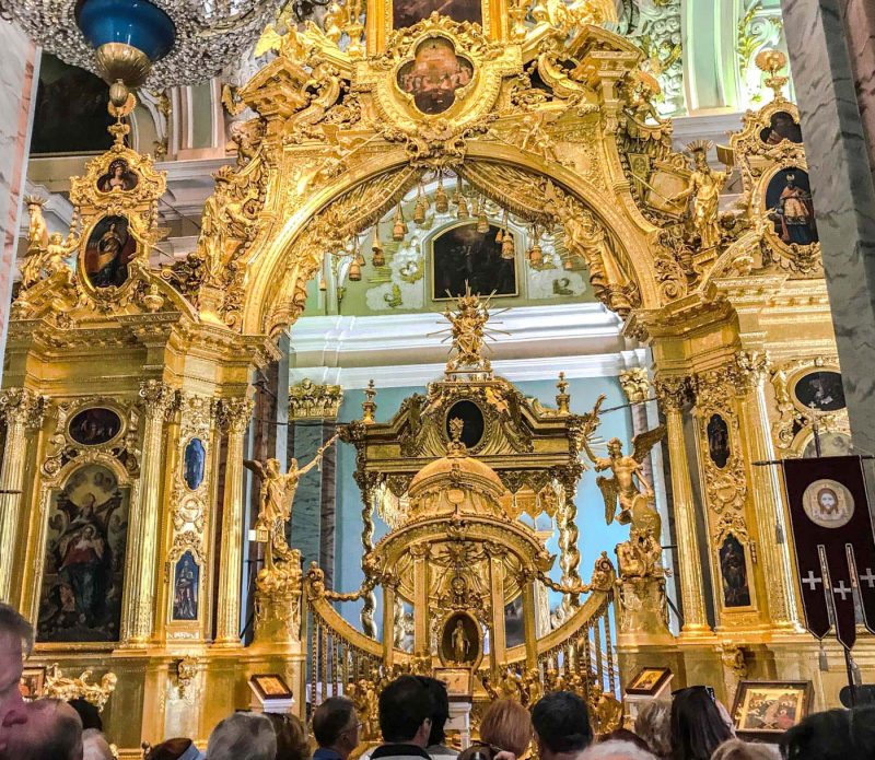 The golden-colored iconostasis, completed by a group of 40 Moscow architects in 1727, at the front of Sts. Peter and Paul Cathedral in St. Petersburg.