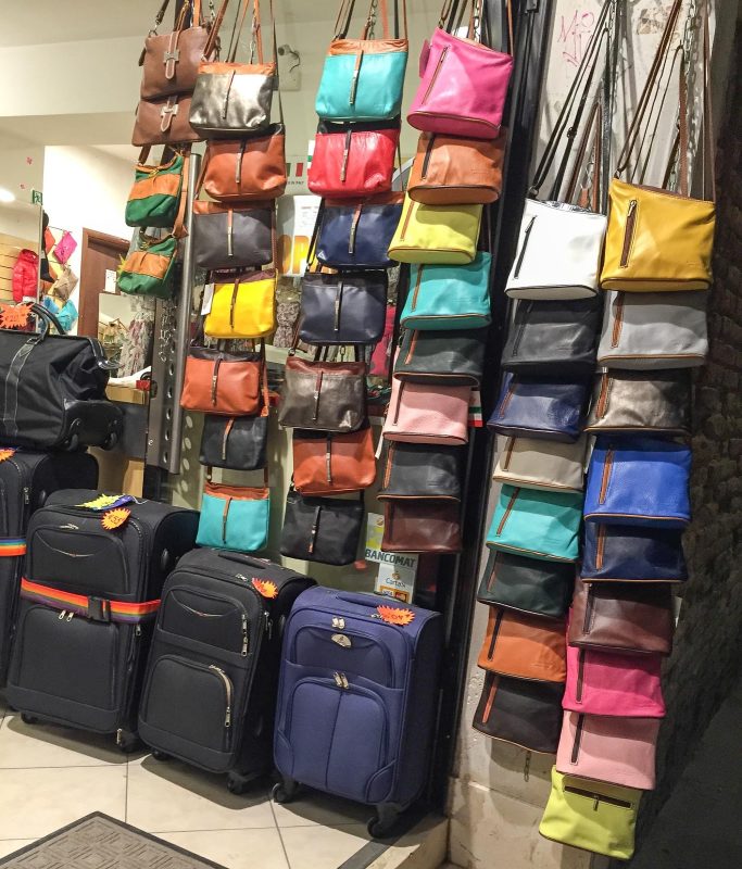 Modern handbags and luggage in a shop in Venice.