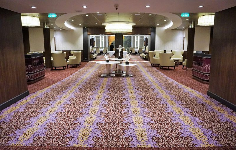 A hallway leading to the Grande Dining Room on deck 4 of Harmony of the Seas.