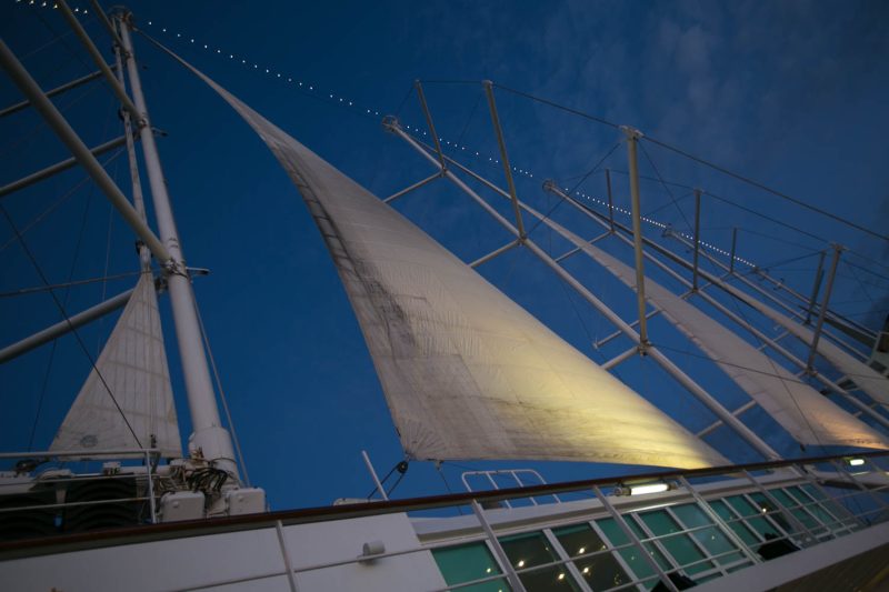 The sails at twilight on Wind Surf, flagship of Windstar Cruises.