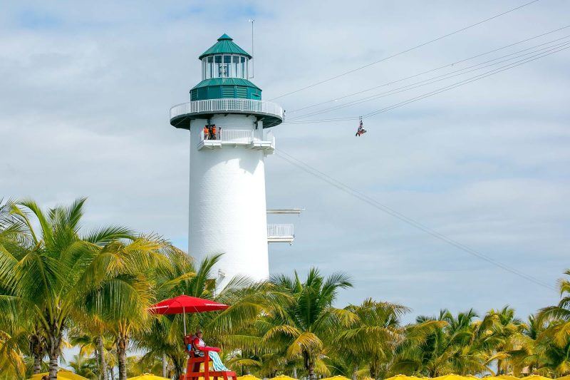 A zipliner takes off from the Flighthouse at Harvest Caye in Belize.