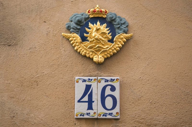 The symbol of a phoenix above a doorway in Stockholm indicates the house is insured.