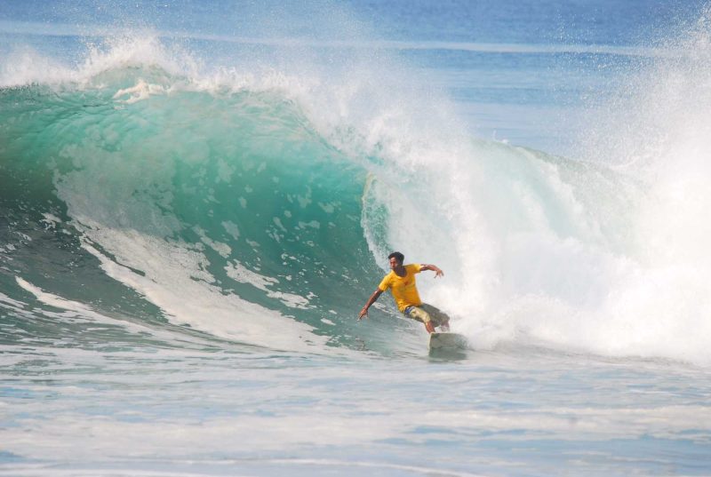 Surfing the big waves in Mazatlan, Mexico.