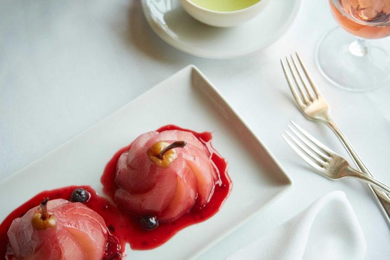 A poached pear dish served at Canaletto on your Holland America cruise.