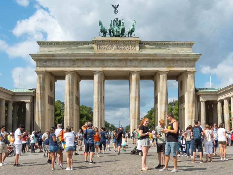 The always-crowded Brandenburg Gate is a neoclassical monument in Berlin built in the 1700s.