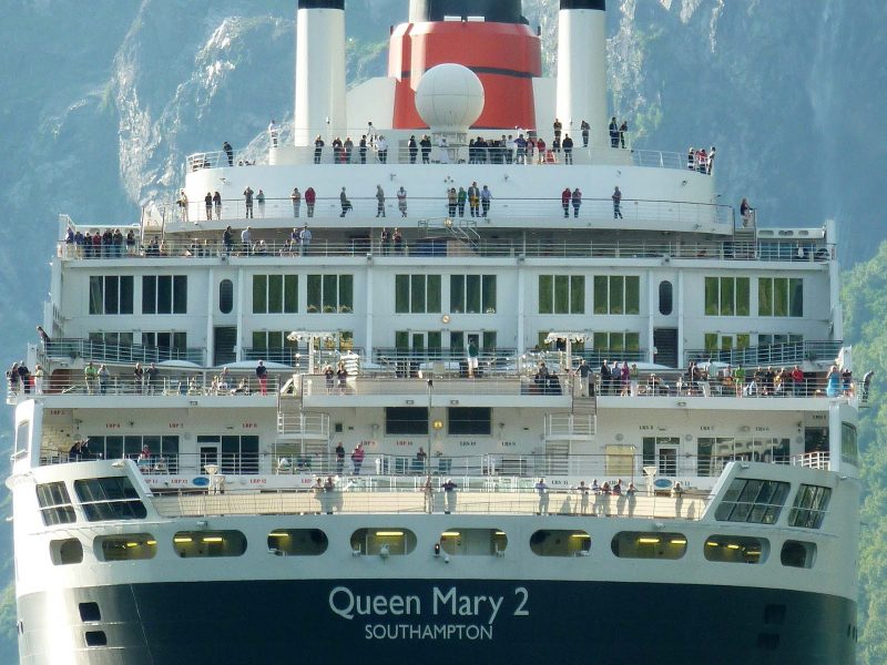 Passengers gather on the deck of Queen Mary 2.
