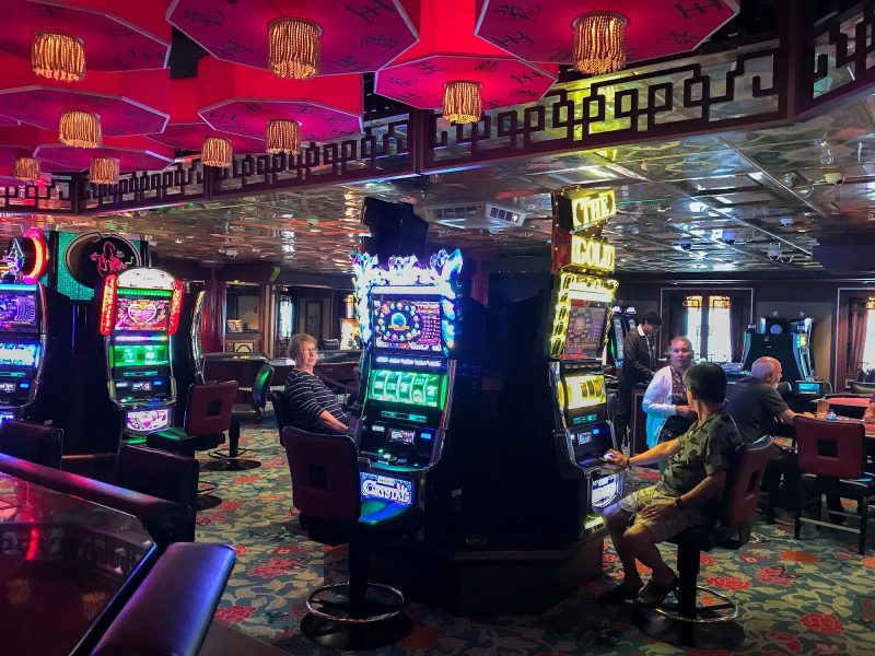 Passengers get busy in the Casino aboard Norwegian Jade.