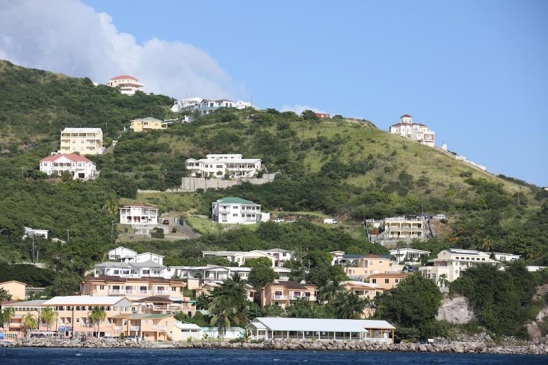 Houses line the coastline of St. Kitts.