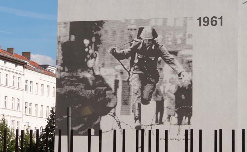 Peter Leibing's 1961 photo of an East German border guard who successfully escaped but later committed suicide adorns the side of a building at the Berlin Wall.