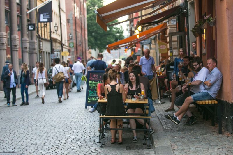 Visitors stop for dinner along the main street of Gamla stan, Stockholm’s old town.