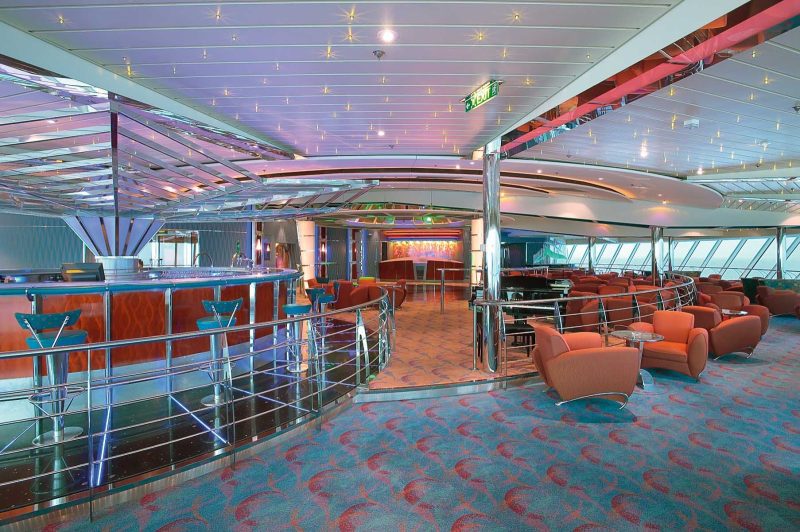 Have a drink or make new friends at the disco-style Vortex Bar aboard Jewel of the Seas.