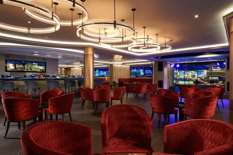 Enjoy entertainment and signature cocktails alongside Norwegian Escape's casino at the Skyline Bar.