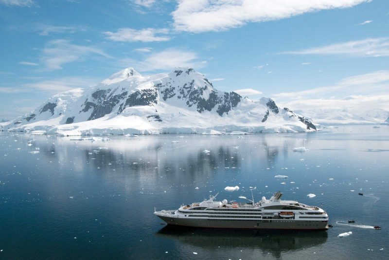 Le Boreal sails past the Aitcho Islands in the South Shetland Islands, Antarctica.