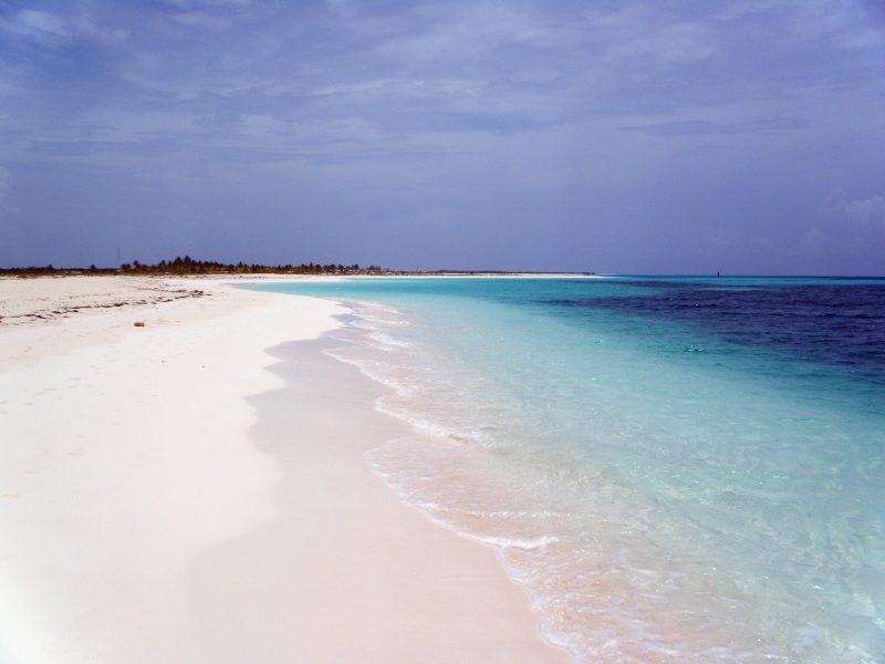 A long stretch of empty beach in Cuba.