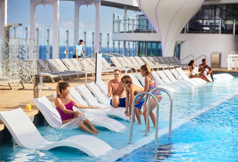The pretty main pool on Celebrity Edge class ships holds appeal to families and to anyone who wants to swim laps.