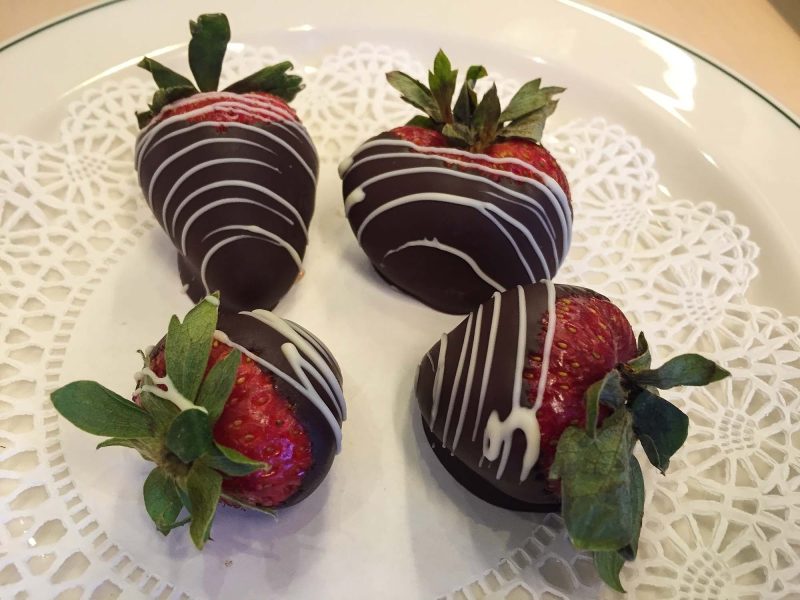 Chocolate-covered strawberries await a guest in his stateroom on the first day of a sailing on Ruby Princess.