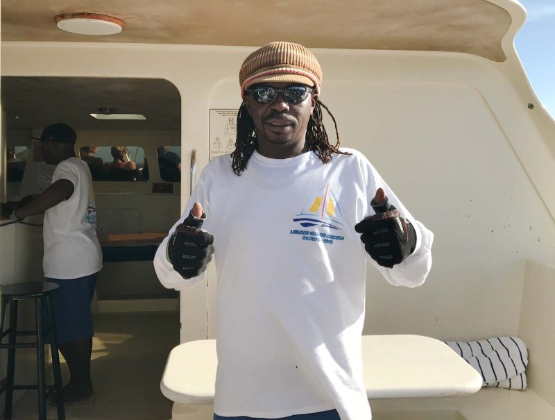 Saint Clare, a crew member of Leeward Islands Charters during a catamaran outing in St. Kitts.