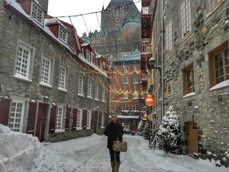 Quebec City looks festive under holiday lights at twilight.