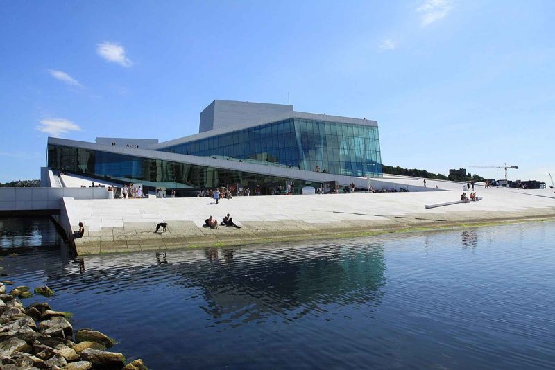 The Oslo Opera House in Bjørvika neighborhood of central Oslo, Norway, is located on Oslofjord.