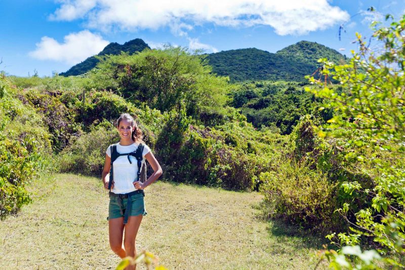 Hiking between the two smaller twin mountains of Signal Hill and Little Mountain on the island of St. Eustatius.