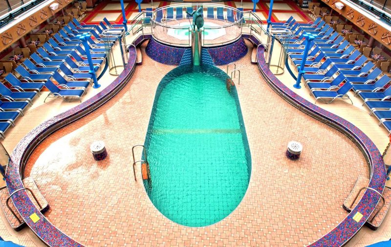 On cool days the Ulysses Pool — one of four swimming pools on Carnival Miracle — and its whirlpool are covered by a retractable glass roof.