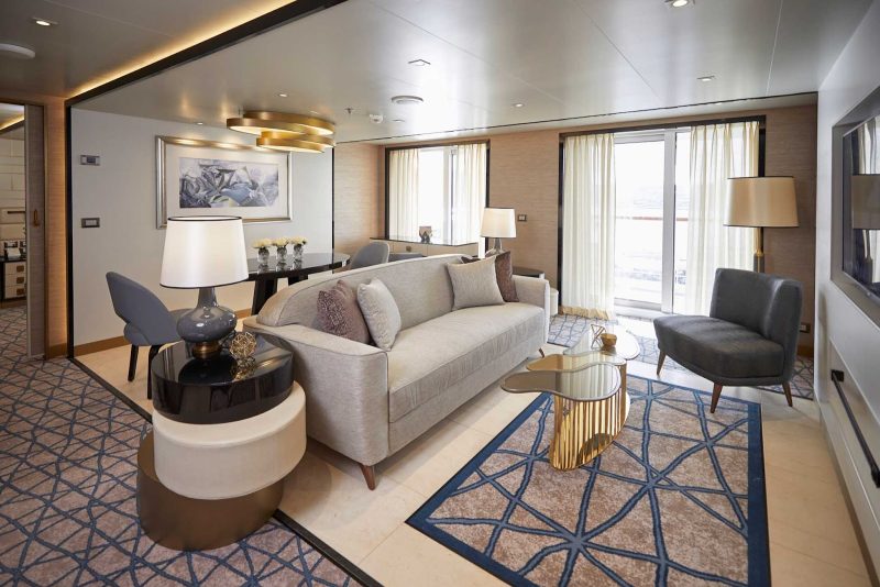 The living room area of a suite on Seven Seas Splendor.