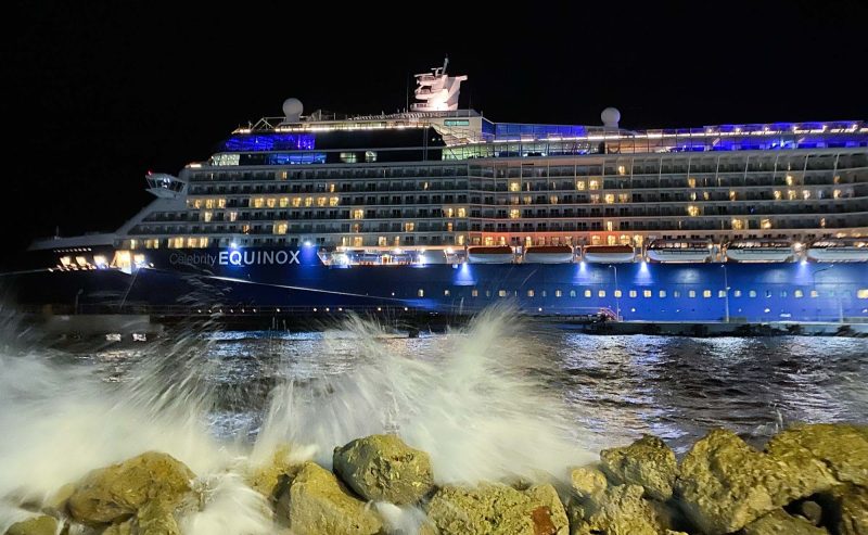 Celebrity Equinox docked in Willemstad, Curacao, at night.