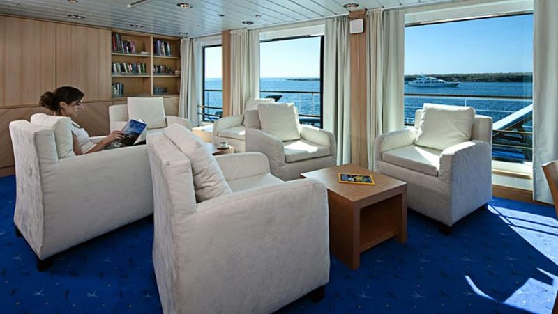 A well stocked library on La Pinta offers spectacular views.
