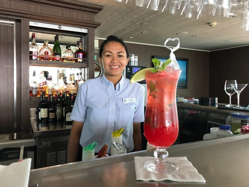 Bar steward Maria Lawag whips up a strawberry mojito in Wind Surf's Compass Rose bar.