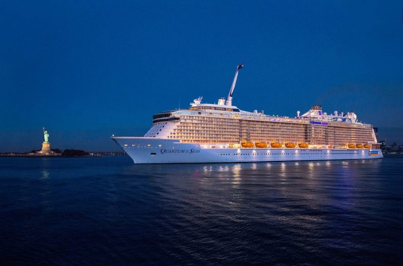 Quantum of the Seas in New York Harbor at twilight.