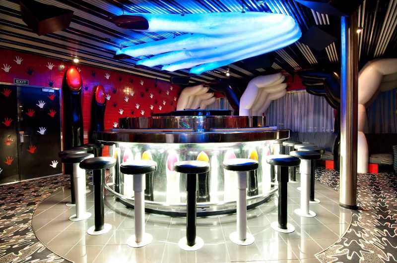 Sing along to your favorite tunes at Touch of Class, a popular piano bar on Carnival Sensation.